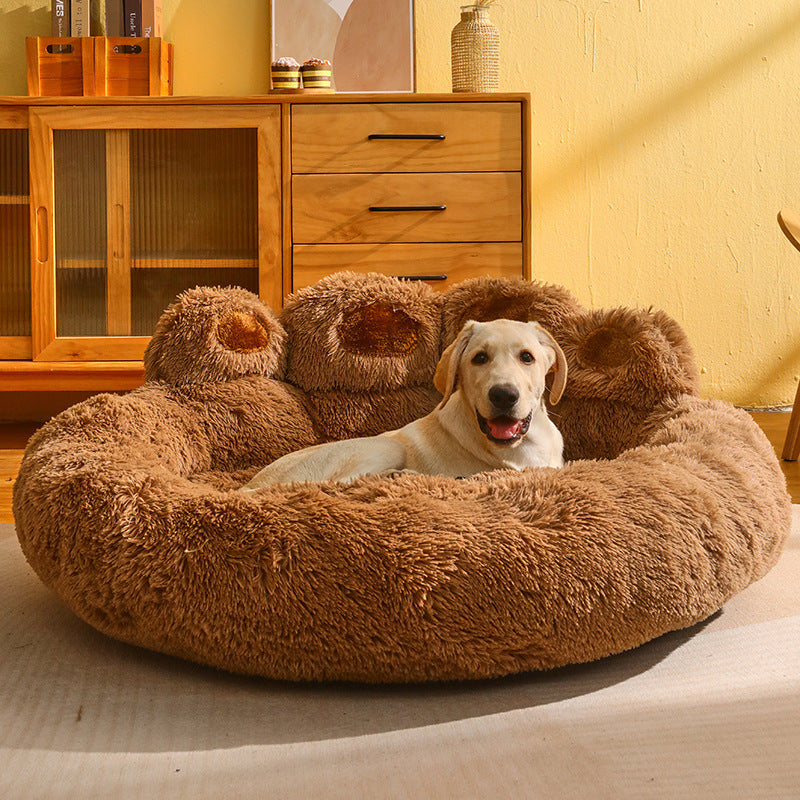 A dog lying on a fluffy brown Bear Paw Pet Sofa Bed in a cozy room.