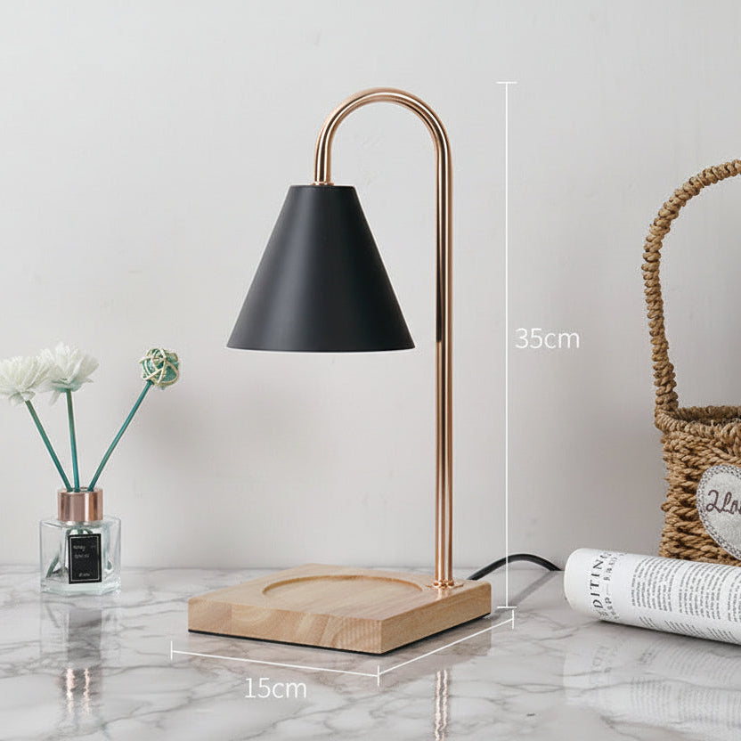 Table lamp with black shade and wooden base on a marble surface