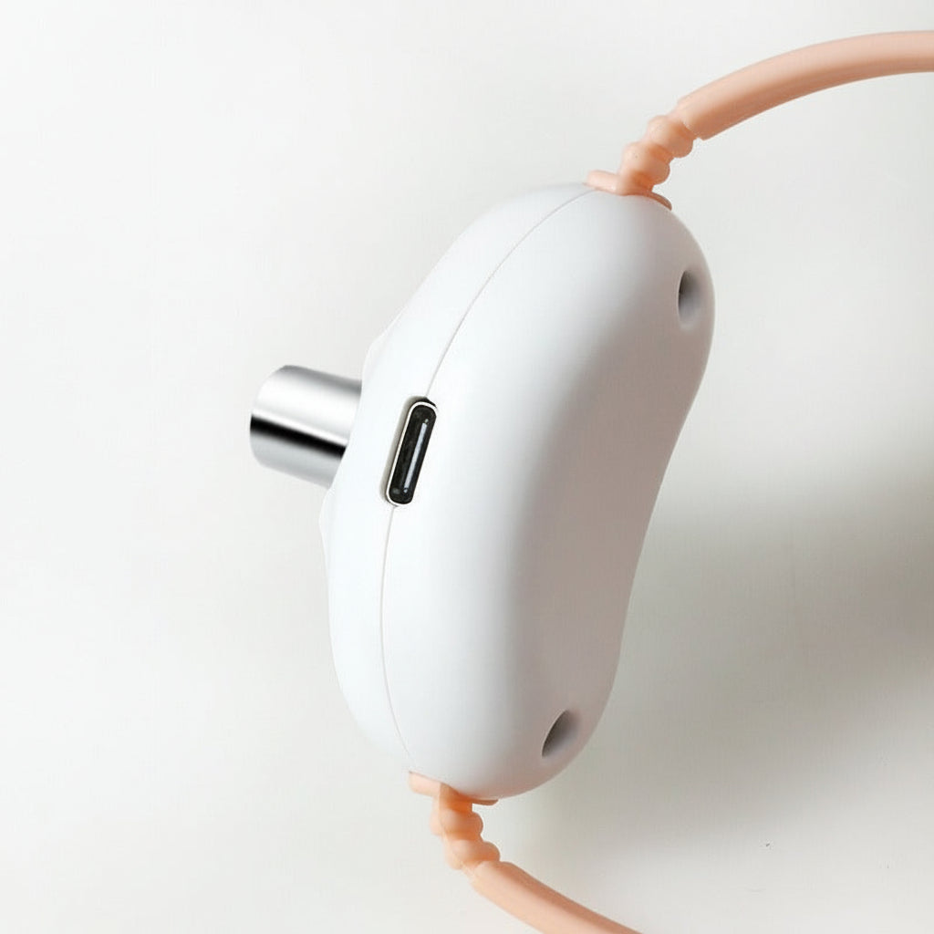 White electronic device with USB charging port on a light gray background