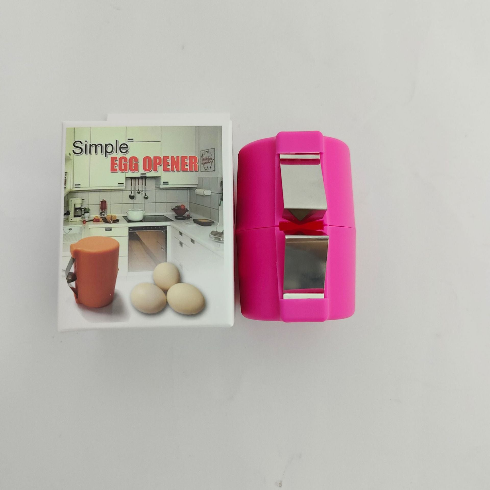 Pink egg opener with packaging featuring an image of eggs and a kitchen.