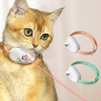Cat wearing a pet toy with laser feature, accompanied by two additional toys on a light background.