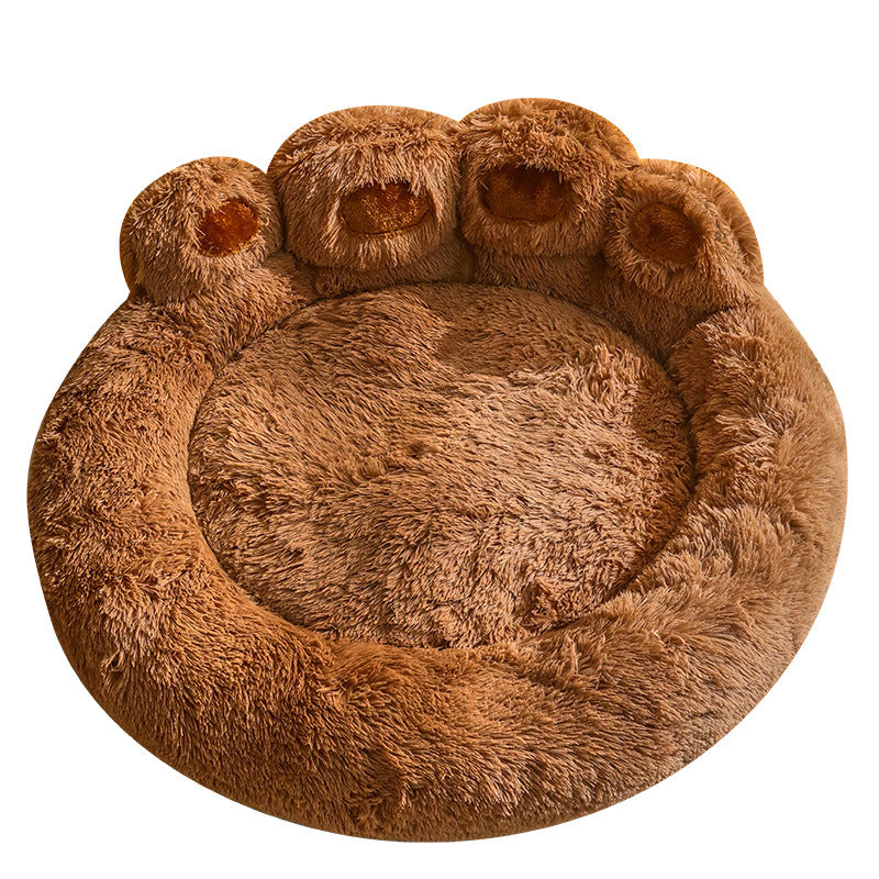 Brown paw-shaped pet bed on a white background