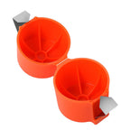 Orange plastic egg holders with metal clips on a white background