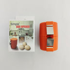 Orange egg opener with packaging featuring an image of eggs and a kitchen.