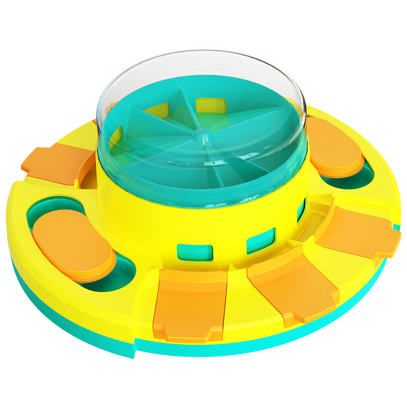 Colorful dog treat feeding toy with a central transparent disk on a white background