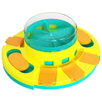 Colorful dog treat feeding toy with a central transparent disk on a white background