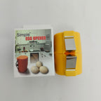 Yellow egg opener with packaging featuring an image of eggs and a kitchen.